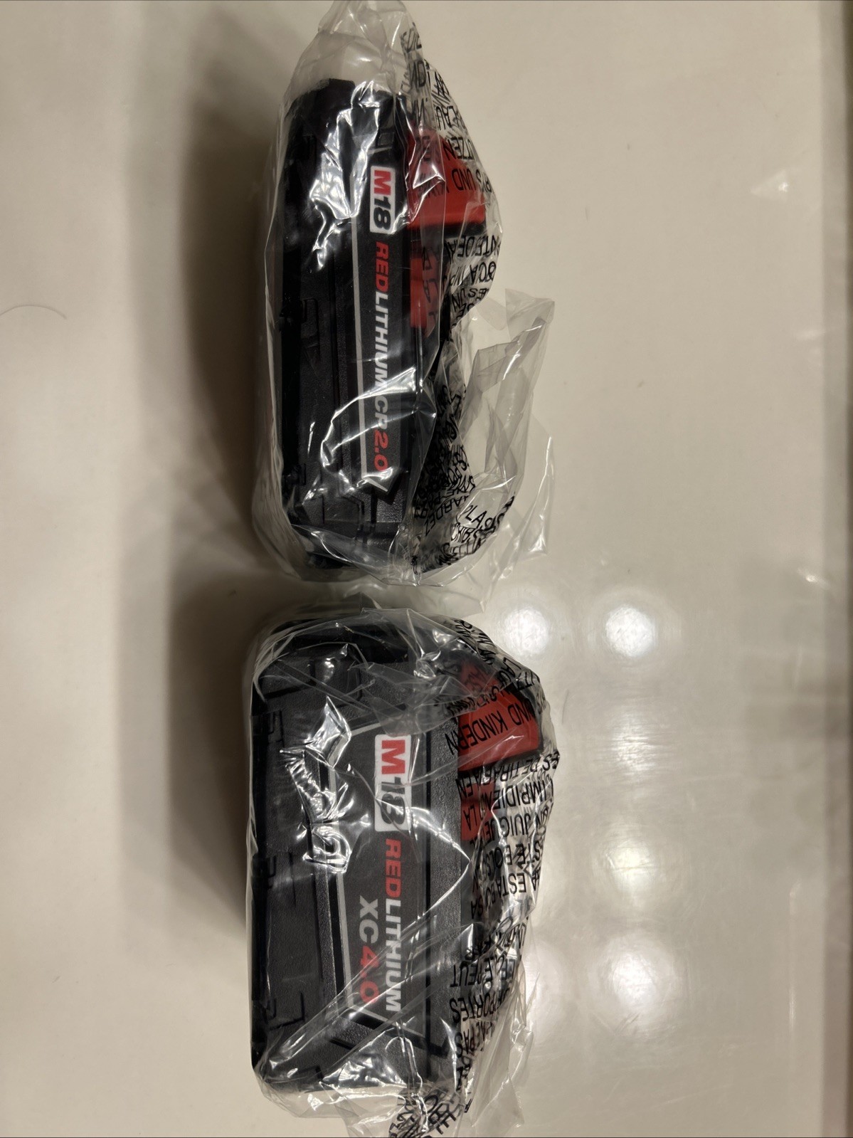 Milwaukee M12/M18 MULTIVOLTAGE CHARGERS and M18 LI-lON BATTERY PACKS