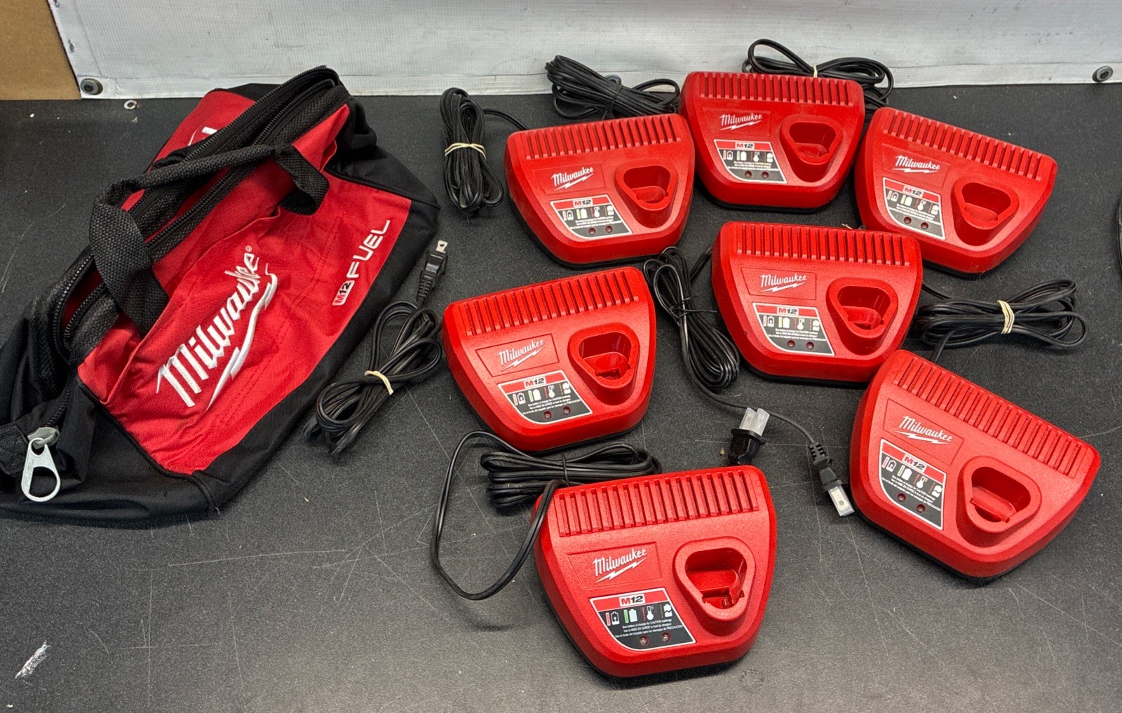 Milwaukee M12 Fuel Bag + (7) New Battery Chargers M12 12V USA Lithium 48-59-2401