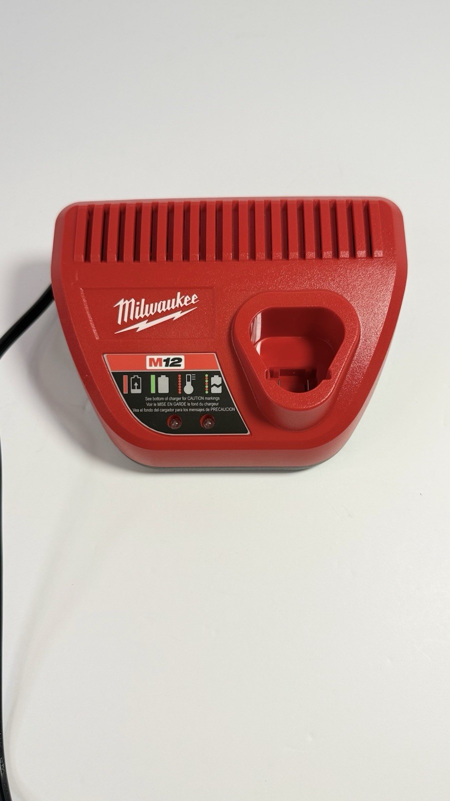 Milwaukee M12 Charger Red 48-59-2401 Charges 1. Battery not included.