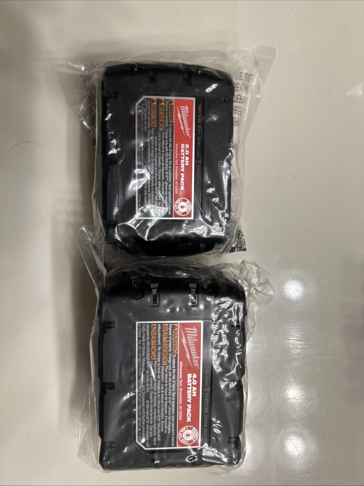 Milwaukee M12/M18 MULTIVOLTAGE CHARGERS and M18 LI-lON BATTERY PACKS