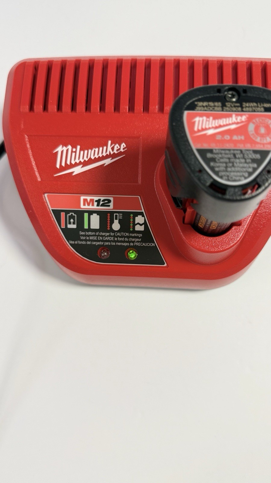 Milwaukee M12 Charger Red 48-59-2401 Charges 1. Battery not included.