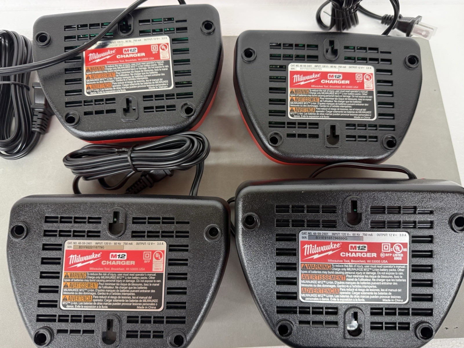 Lot Of 4 Milwaukee M12 Chargers Model 48-59-2401 And Milwaukee Soft Case